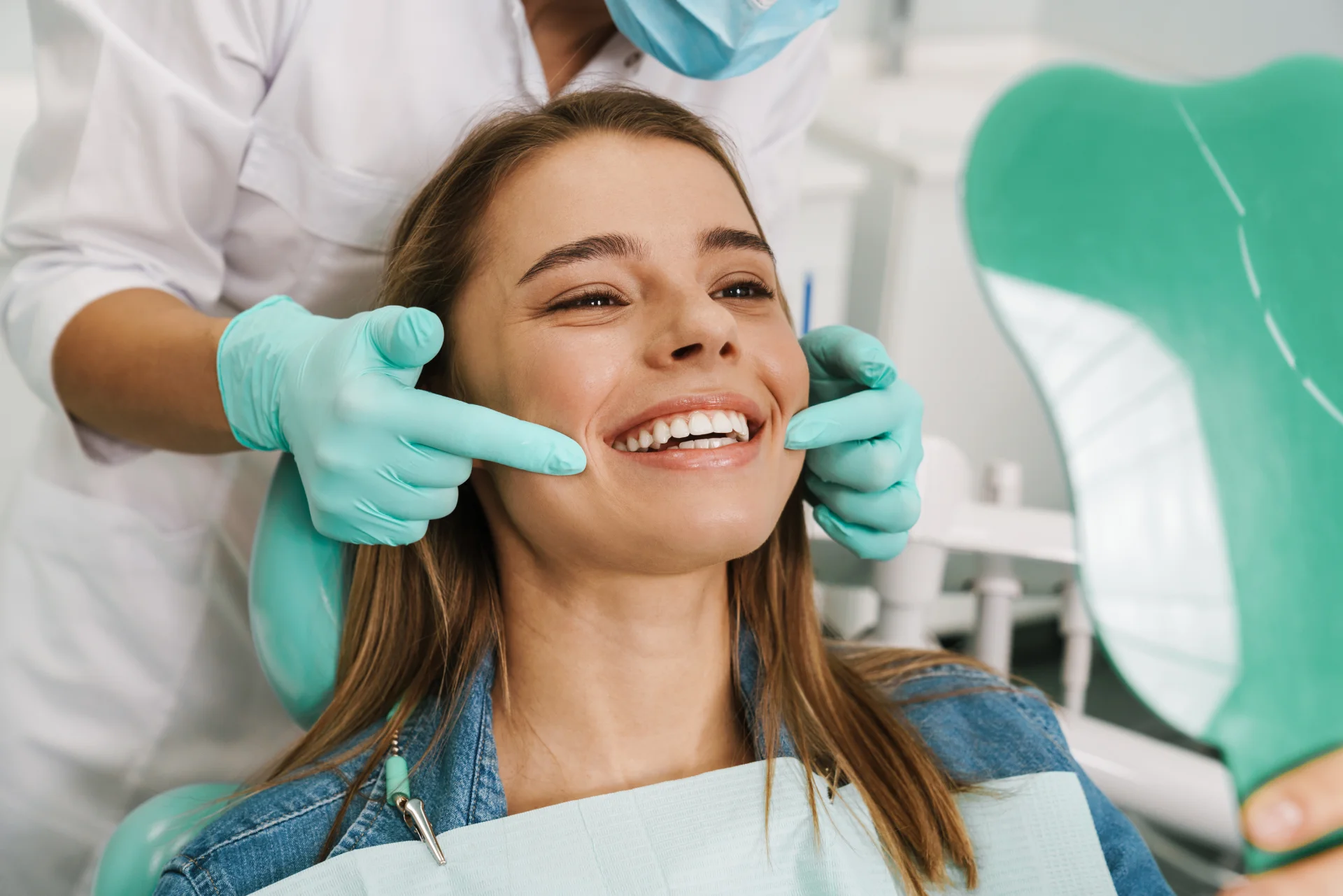 Smiling patient showing cosmetic dentistry results at Mantena Dental